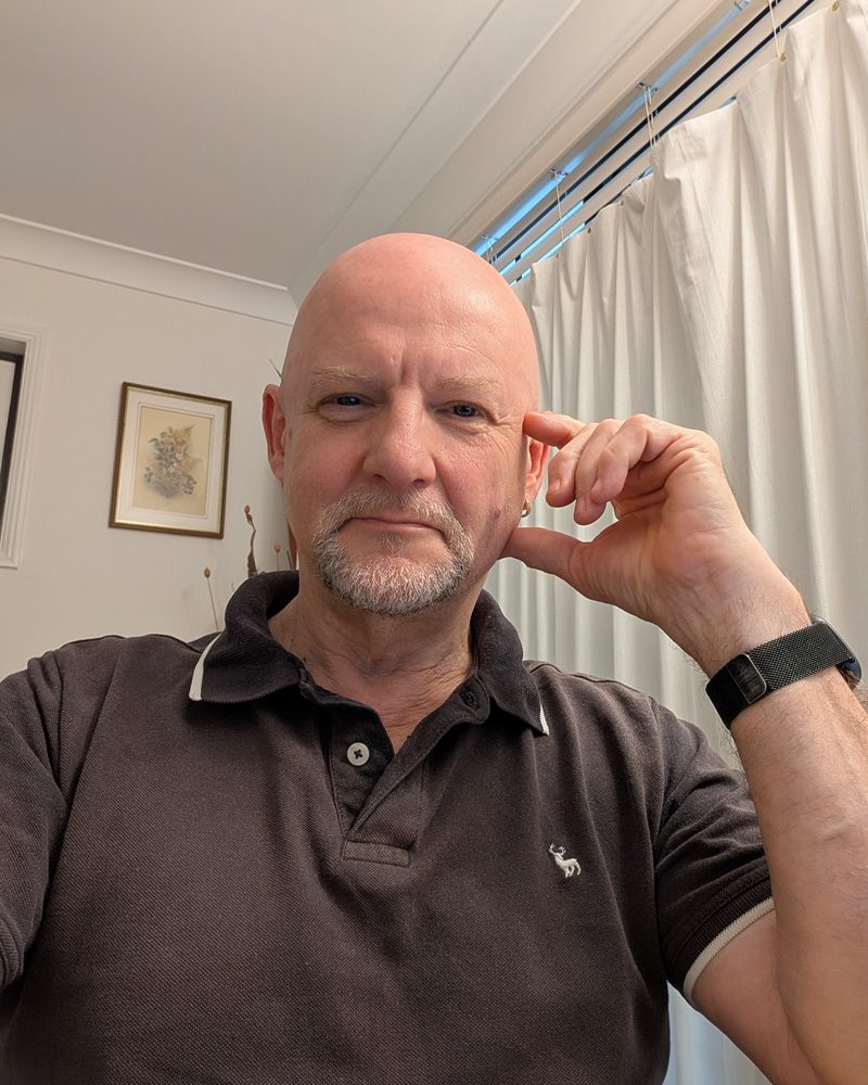 Stewart Gatenby looking into the camera in the softly furnished clinic room at Point Vernon
