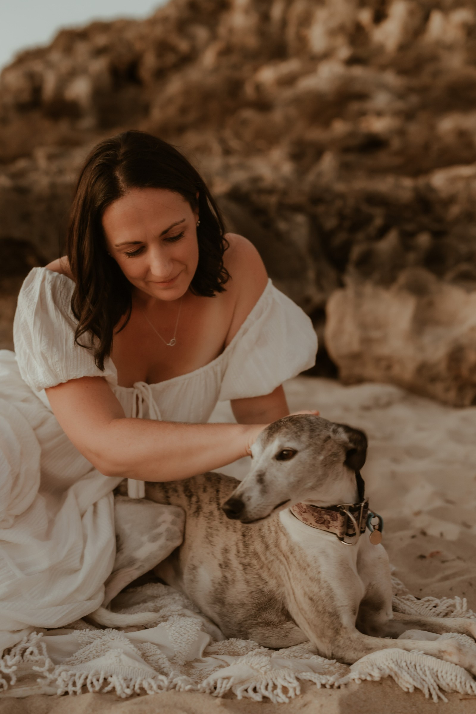 Jacqui Clune sitting with her dog, Tilly (whippet)
